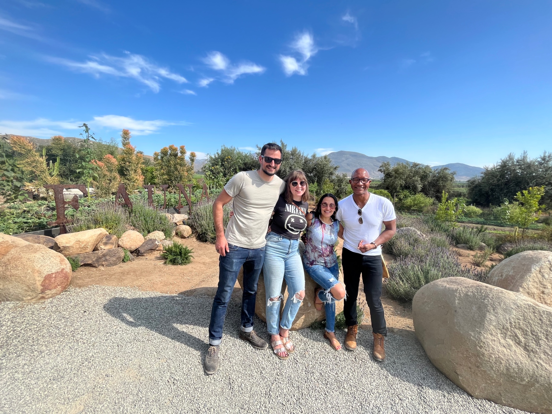 Friends gathered at Fauna, among lavender and the mountains of Valle de Guadalupe.