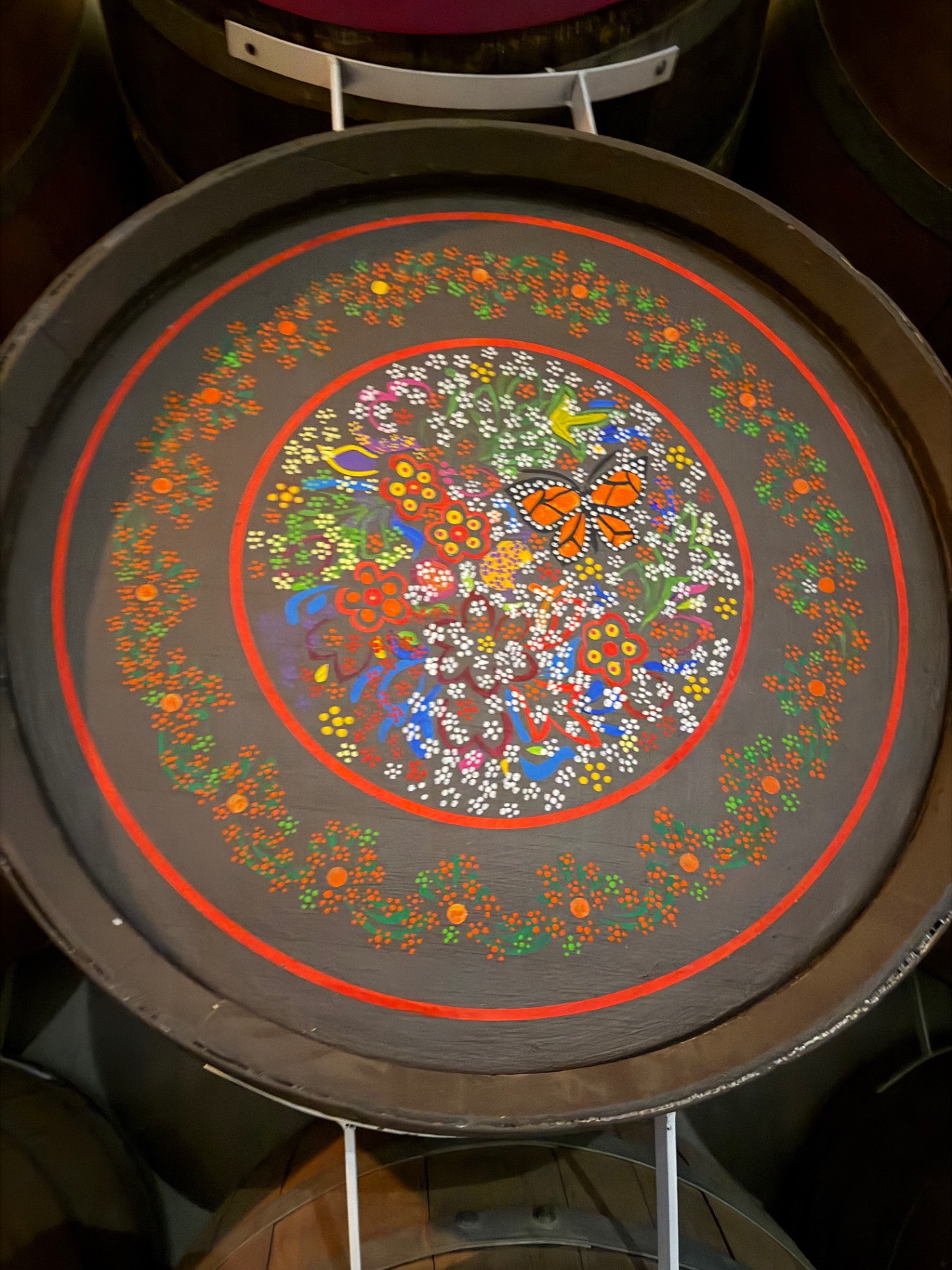 Hand-painted face of an oak barrel.