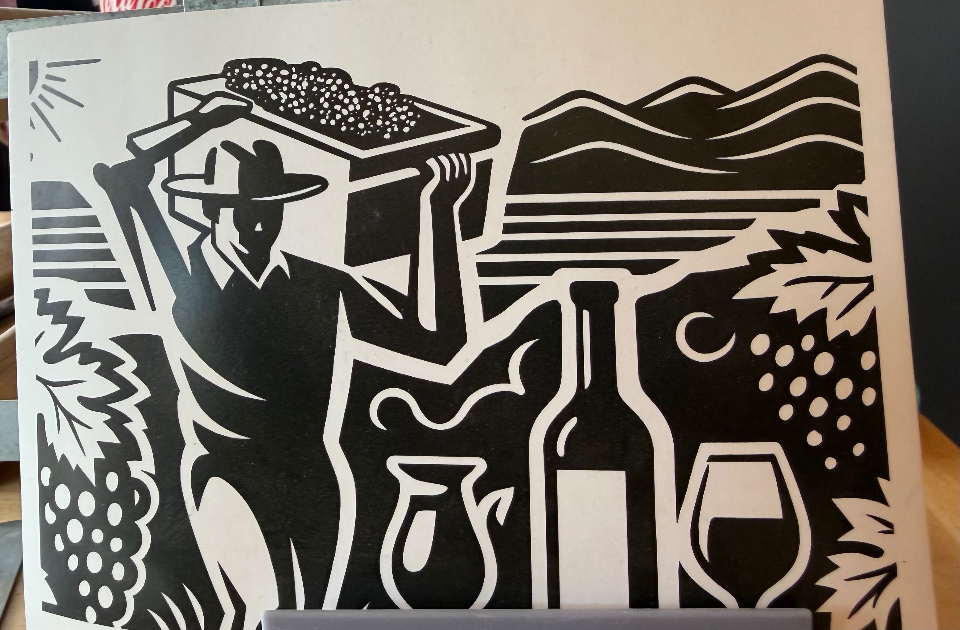 Handmade woodcut print of the harvester in Valle de Guadalupe — traditional art honoring the harvest, the land, and the memory of Mexican wine.