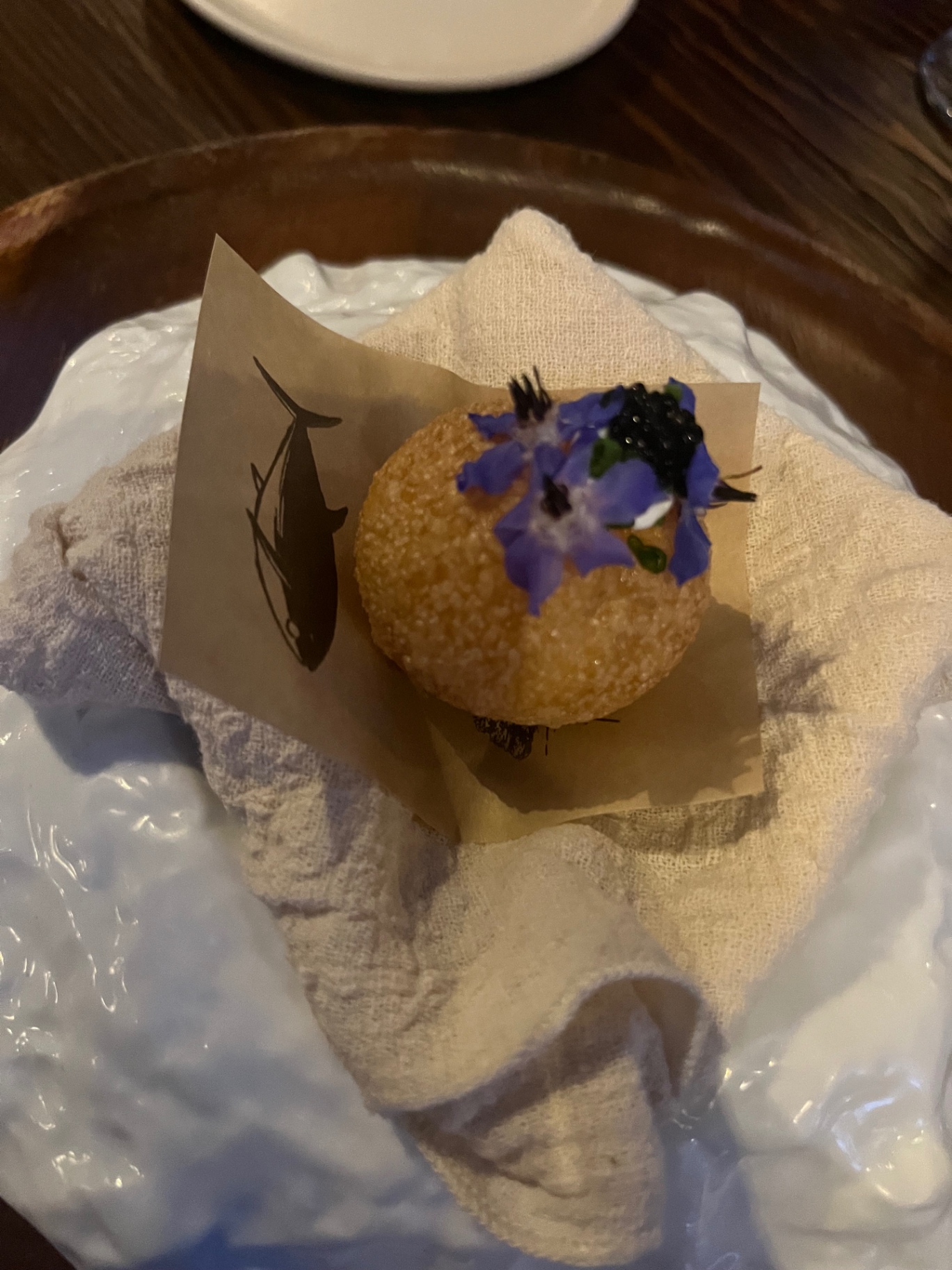 Tuna bite with caviar and borage blossom.