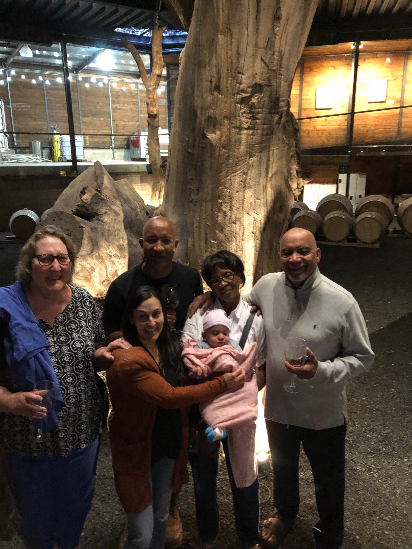 Three generations of the Jostein family with wine at a Valle winery.